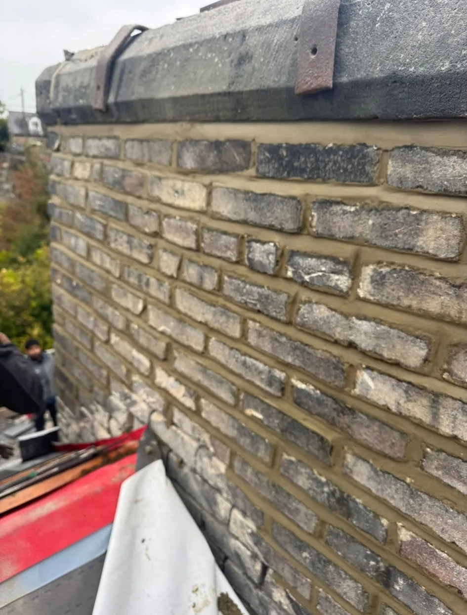 Chimney stack freshly repointed with new mortar joints by CJroofing