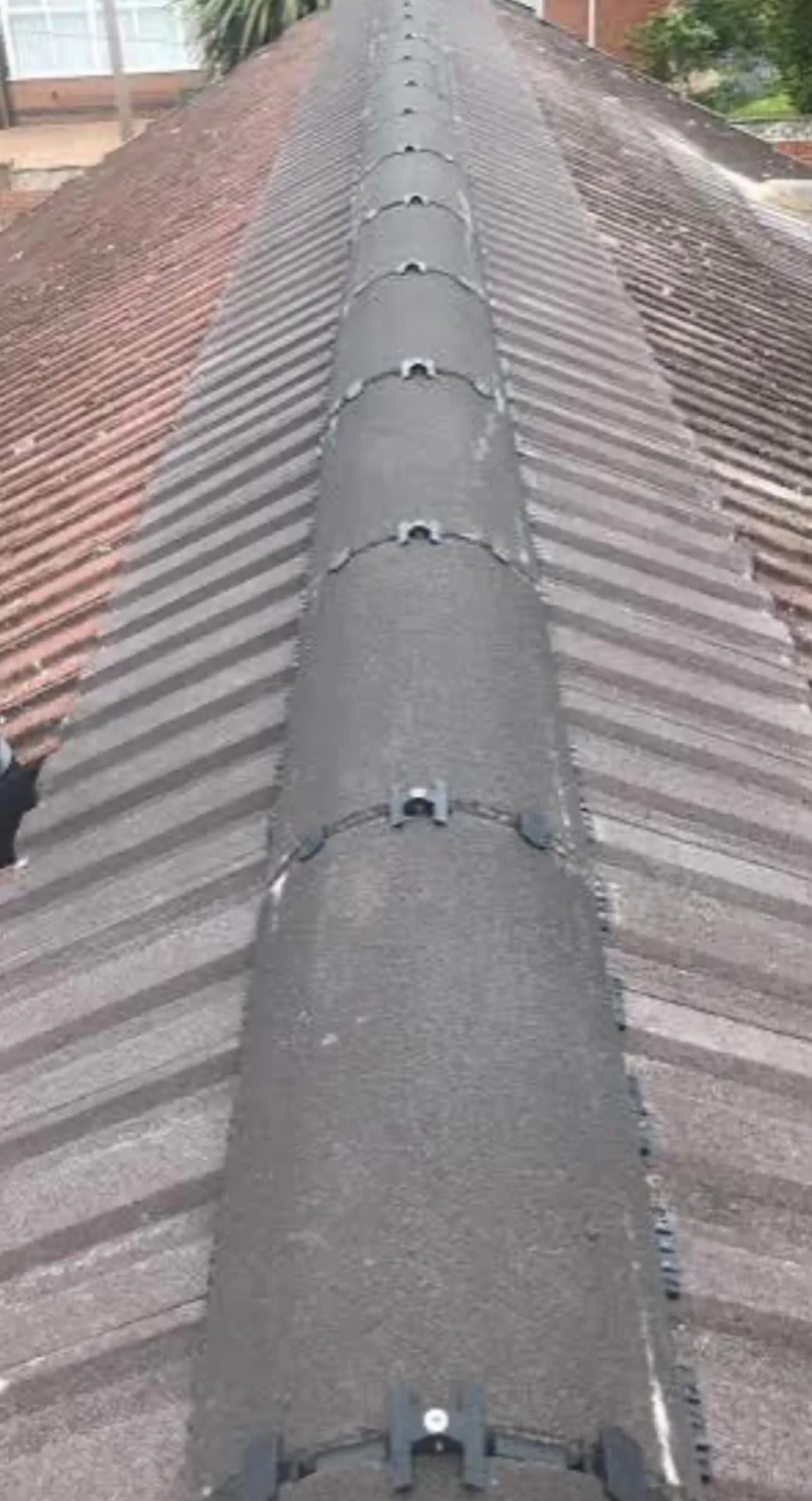 Dry ridge system fitted along the ridge of a tiled roof